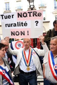 FRANCE, Paris: French mayors of rural towns demonstrate in front of the National Assembly, in Paris, on June 24, 2015, to protest against the draft law NOTRe (Nouvelle organisation territoriale de la République, in english: Republic's new territorial organization). These mayors mainly fear losing their current prerogatives and power. - CITIZENSIDE/GEORGES DARMON